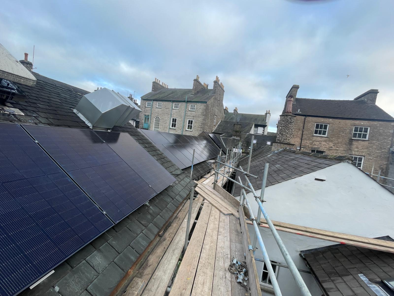 Kendal commercial solar panel installation in progress showing slate roof work